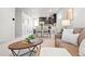 Bright living room and dining area with neutral decor and modern finishes at 12777 Ulster St, Thornton, CO 80602