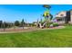 Community playground featuring modern equipment and a soft landing surface, perfect for children at 12777 Ulster St, Thornton, CO 80602