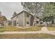 Attractive apartment building with stone accents and mature trees set in a well-maintained landscape at 18073 E Ohio Ave # 203, Aurora, CO 80017