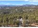 Luxury home with mountain views and forest landscape at 25220 Montane Dr, Golden, CO 80401