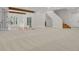Spacious finished basement with wood beams, carpeting, and abundant natural light at 25220 Montane Dr, Golden, CO 80401