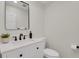 Powder room with single vanity and toilet at 25220 Montane Dr, Golden, CO 80401