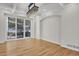 Spacious dining room with hardwood floors, large windows, and a modern chandelier at 25220 Montane Dr, Golden, CO 80401