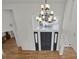 Grand two-story entryway with a dramatic chandelier and dark wood floors at 25220 Montane Dr, Golden, CO 80401