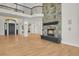 Two story great room with a stone fireplace and hardwood floors at 25220 Montane Dr, Golden, CO 80401