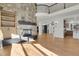 Open floor plan with a stone fireplace and hardwood floors at 25220 Montane Dr, Golden, CO 80401