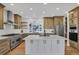 Modern kitchen with stainless steel appliances and large island at 25220 Montane Dr, Golden, CO 80401