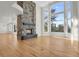Open living space with stone fireplace and abundant natural light at 25220 Montane Dr, Golden, CO 80401