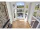 High-ceiling living room with stone fireplace and scenic view at 25220 Montane Dr, Golden, CO 80401