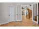 Home office with hardwood floors and view of grand staircase at 25220 Montane Dr, Golden, CO 80401