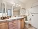 Bathroom features a large mirror, granite countertop, and a shower at 7755 E Quincy Ave # 301A7, Denver, CO 80237