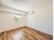 Bedroom features hardwood floors, a window and a closet at 7755 E Quincy Ave # 301A7, Denver, CO 80237