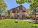 Apartment building showcasing balconies, brickwork, and landscaping at 7755 E Quincy Ave # 301A7, Denver, CO 80237