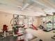 Gym featuring multiple workout machines and natural light at 7755 E Quincy Ave # 301A7, Denver, CO 80237