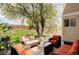 Lush backyard oasis with mature trees, outdoor seating, and custom patio, perfect for entertaining at 9469 W Ute Dr, Littleton, CO 80128