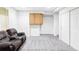Spacious basement area with neutral carpet and ample storage, offering versatile living options at 9469 W Ute Dr, Littleton, CO 80128
