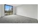 Bedroom with gray carpet, neutral walls, a big window with a view, and lots of light at 1111 Race St # 6B, Denver, CO 80206