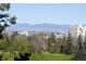 Scenic view of the city skyline and mountains from property at 1111 Race St # 6B, Denver, CO 80206