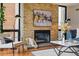 Inviting living room with a stone fireplace, modern artwork, and comfortable seating at 1111 Race St # 6B, Denver, CO 80206