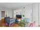 Stylish home office is adjacent to the spacious living room with comfortable seating at 1111 Race St # 6B, Denver, CO 80206