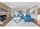 Spacious living room featuring stylish furniture, a modern fireplace, and elegant decor at 1111 Race St # 6B, Denver, CO 80206