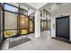Contemporary lobby with seating areas, large windows, and elevator access at 1111 Race St # 6B, Denver, CO 80206