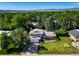 An aerial view of a home surrounded by lush greenery, offering privacy and serenity with mountain views in the distance at 5404 W Rowland Pl, Littleton, CO 80128