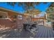 Lovely outdoor deck with dining table and umbrella, perfect for entertaining at 5404 W Rowland Pl, Littleton, CO 80128