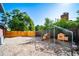 A large backyard with a chicken coop and fence and plenty of space at 5404 W Rowland Pl, Littleton, CO 80128