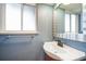 Powder room featuring a modern sink and faucet under a large window at 5404 W Rowland Pl, Littleton, CO 80128