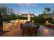 Well-equipped backyard patio with a built-in grill, dining area, and beautiful landscaping at 5810 S Galena St, Greenwood Village, CO 80111