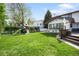 Lush backyard with a play set, swing set, and deck at 5810 S Galena St, Greenwood Village, CO 80111