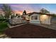 Spacious backyard featuring a built-in grill, a wood deck, and a small shed with garage door at 5810 S Galena St, Greenwood Village, CO 80111