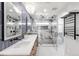 Elegant bathroom with double sinks, quartz counters, and a marble shower with glass door at 5810 S Galena St, Greenwood Village, CO 80111