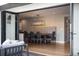 Bright dining room with modern light fixture, seating for six, and backyard views at 5810 S Galena St, Greenwood Village, CO 80111