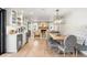 Charming dining area features a stone fireplace, hardwood floors, and ample seating at 5810 S Galena St, Greenwood Village, CO 80111