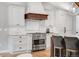 Stylish kitchen featuring white cabinetry, stainless steel appliances, and a large center island at 5810 S Galena St, Greenwood Village, CO 80111