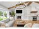 Cozy living room with fireplace, exposed beams, hardwood floors, and stylish furnishings at 5810 S Galena St, Greenwood Village, CO 80111