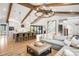 Spacious living room open to the kitchen, featuring exposed beams and stylish decor at 5810 S Galena St, Greenwood Village, CO 80111