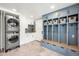 Well-organized mudroom with ample storage, including blue cabinets and a built-in bench at 5810 S Galena St, Greenwood Village, CO 80111