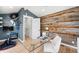 Dual purpose office and workout room with natural wood accent wall at 5810 S Galena St, Greenwood Village, CO 80111