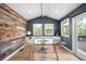 Home office featuring a wood accent wall, built-in cabinets, and a glass-top desk at 5810 S Galena St, Greenwood Village, CO 80111