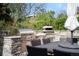 Outdoor kitchen with stone surround and pizza oven at 5810 S Galena St, Greenwood Village, CO 80111
