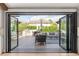 Indoor/outdoor living space with retractable doors and a built in outdoor kitchen at 5810 S Galena St, Greenwood Village, CO 80111
