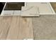 Interior design elements showcase vinyl plank flooring, carpet, quartz countertops, and cabinet and backsplash samples at 2234 Farmlore Dr, Brighton, CO 80601