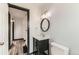 Modern bathroom with stylish vanity, tile flooring, and sleek lighting at 9470 Lillian Ln, Thornton, CO 80229