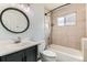 Updated bathroom features tile shower, modern vanity, and updated fixtures at 9470 Lillian Ln, Thornton, CO 80229