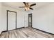 Bedroom with white doors, vinyl floors, and neutral walls at 9470 Lillian Ln, Thornton, CO 80229
