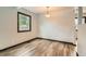 Dedicated dining room area with wood-look floors and modern lighting at 9470 Lillian Ln, Thornton, CO 80229