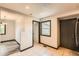 Bright entryway with tile flooring, black trim, and access to multiple rooms at 9470 Lillian Ln, Thornton, CO 80229